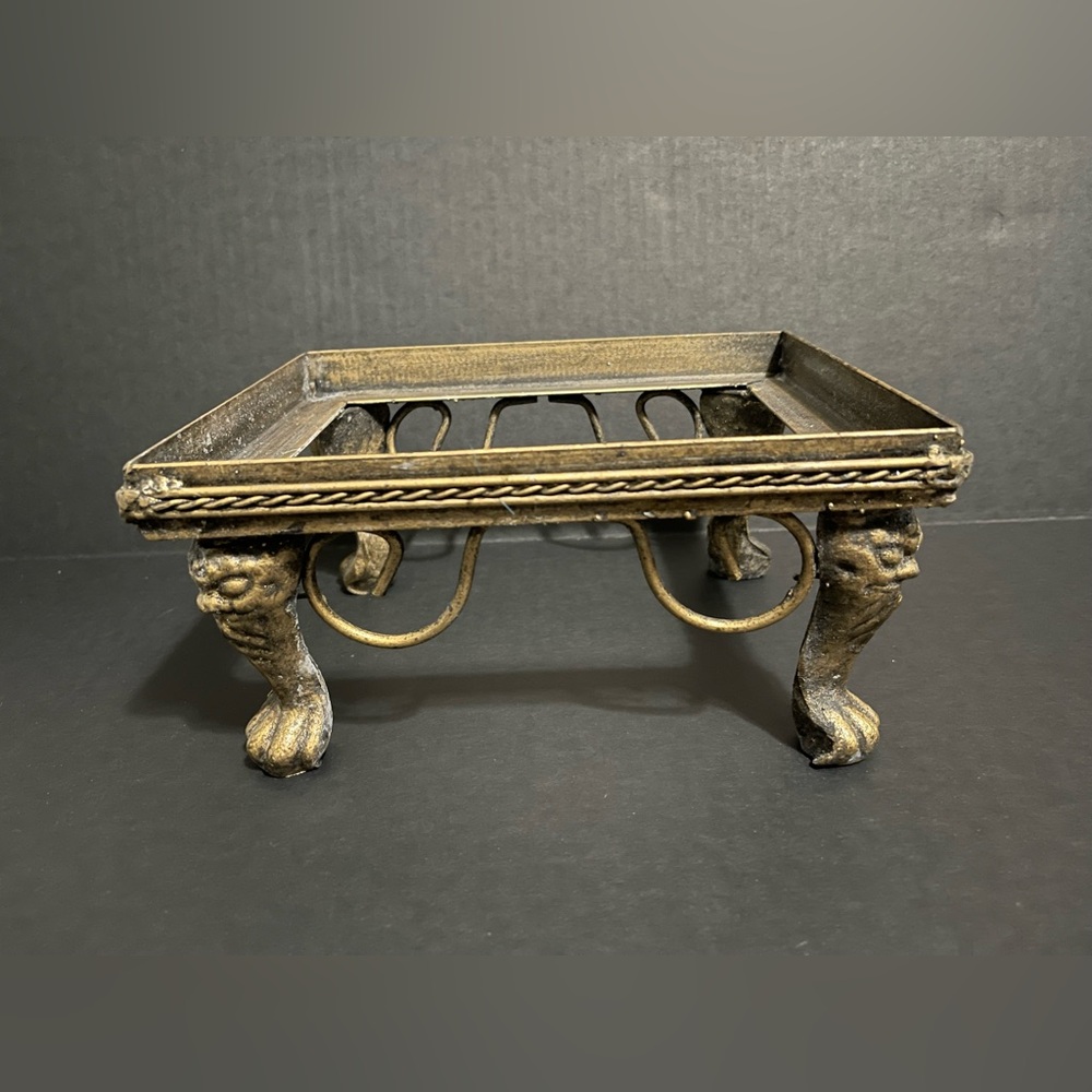 Vintage ornate brass stand with lion paw feet